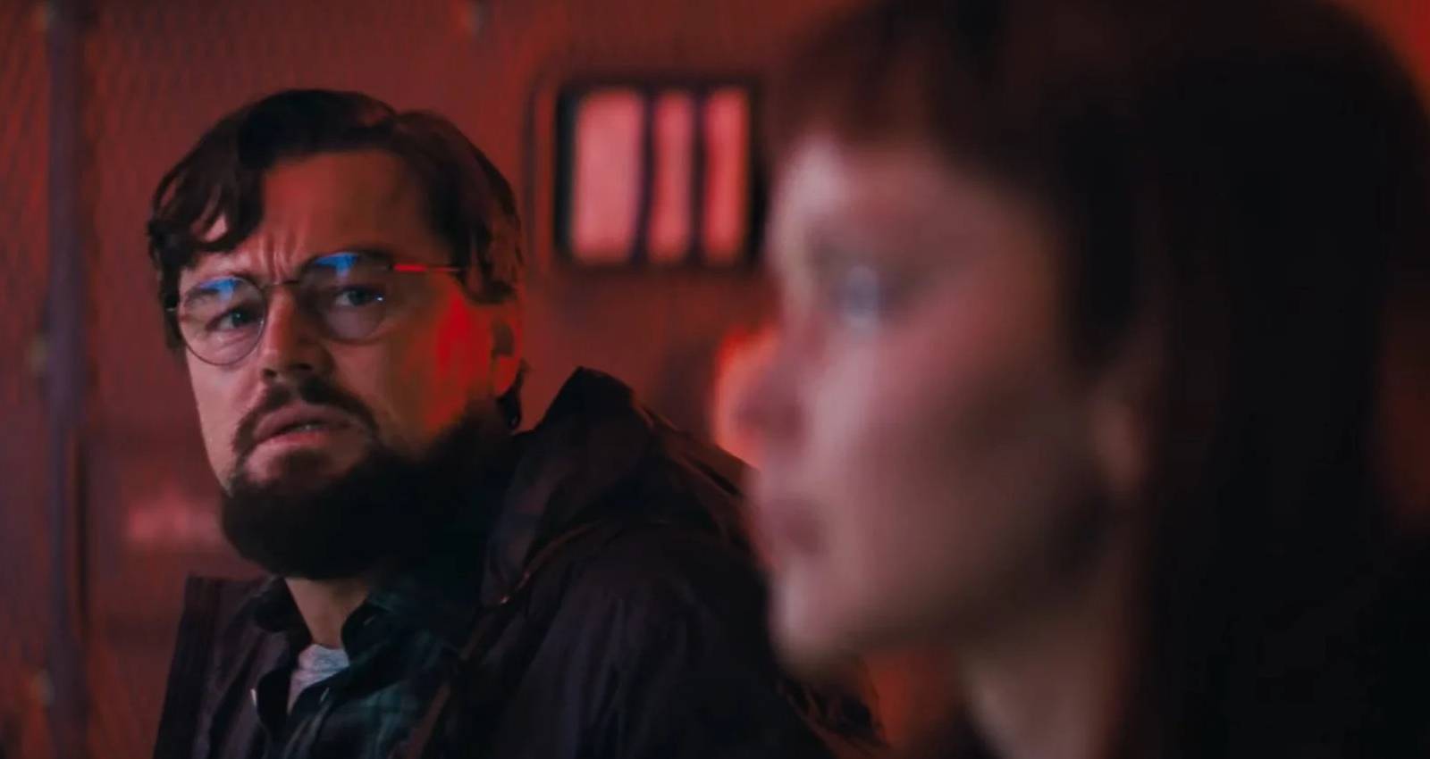 Leonardo DiCaprio looking worried on a military plane in Don't Look Up