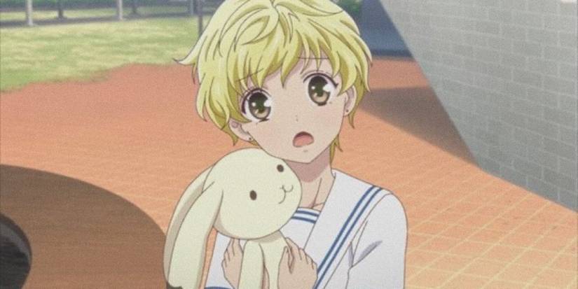 Momiji Sohma hugging a bunny doll