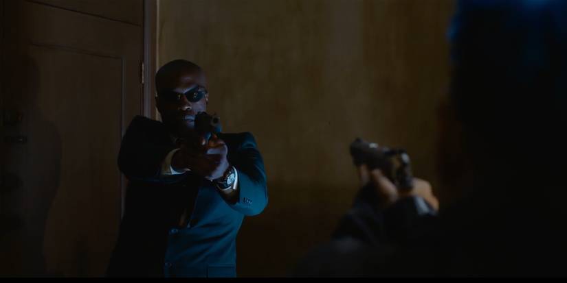 Morpheus and Bugs at gunpoint with each other