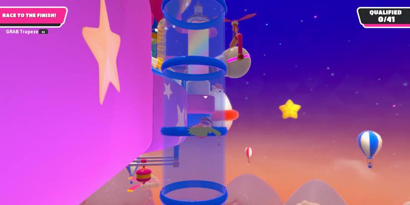 a fall guy bean inside a blue pipe with a night sky and hot air balloons in the background