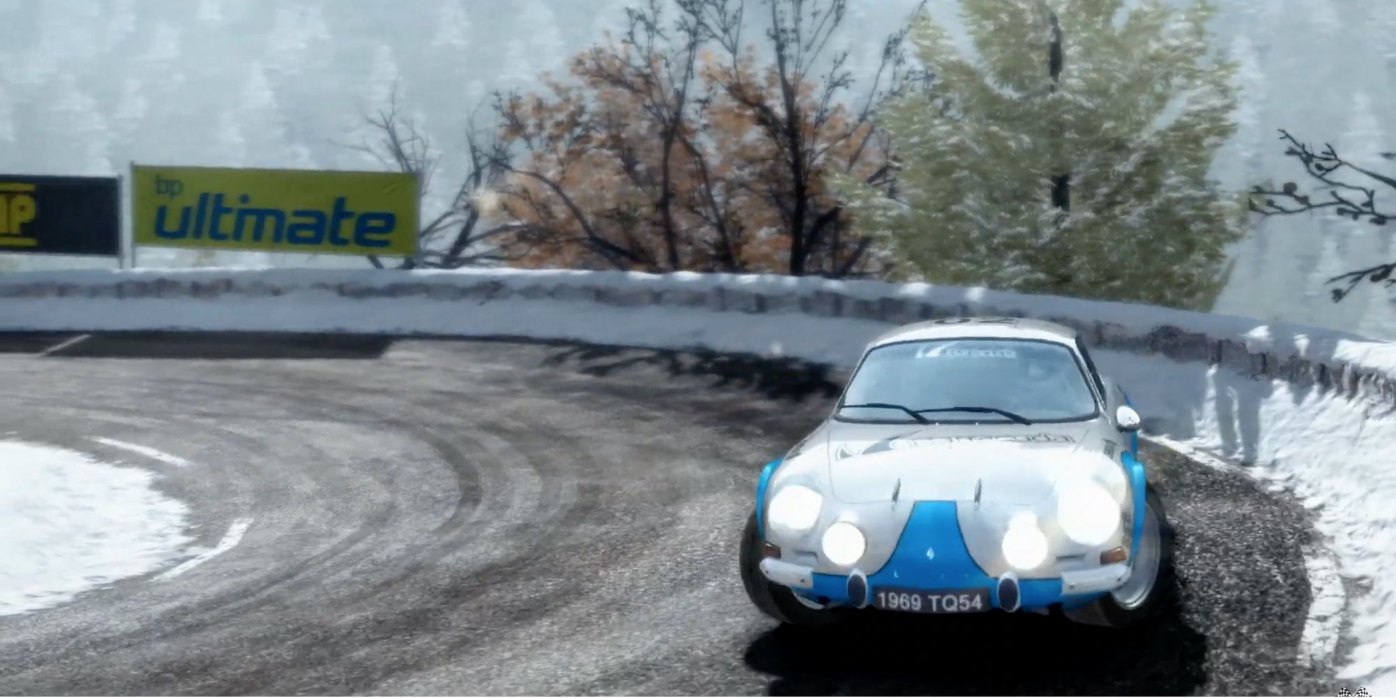 Realistic Racing Games -DiRT Rally - Renault Alpine A110 taking a turn in snow covered streets