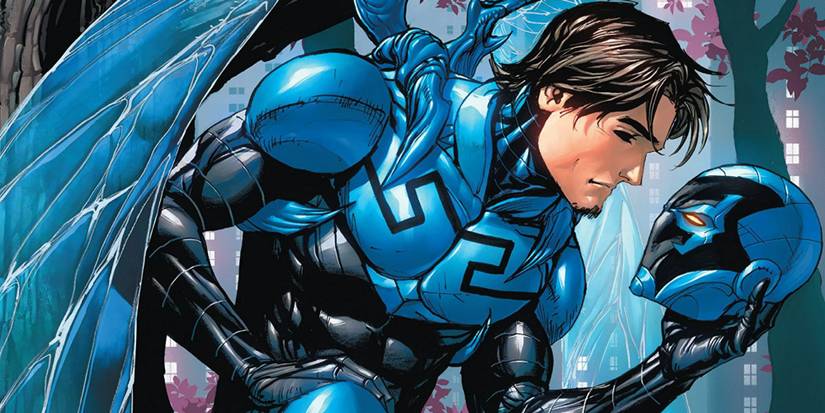 The Blue Beetle holding his mask in Road to Nowhere