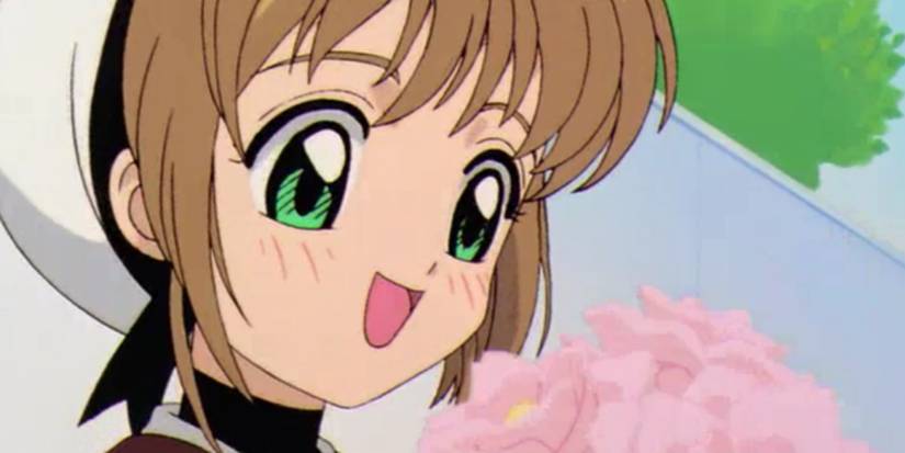 Sakura smiling happily at a flower bouquet