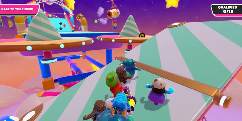 a group of fall guy beans on a green and white teetering platform all running to get to the higher side