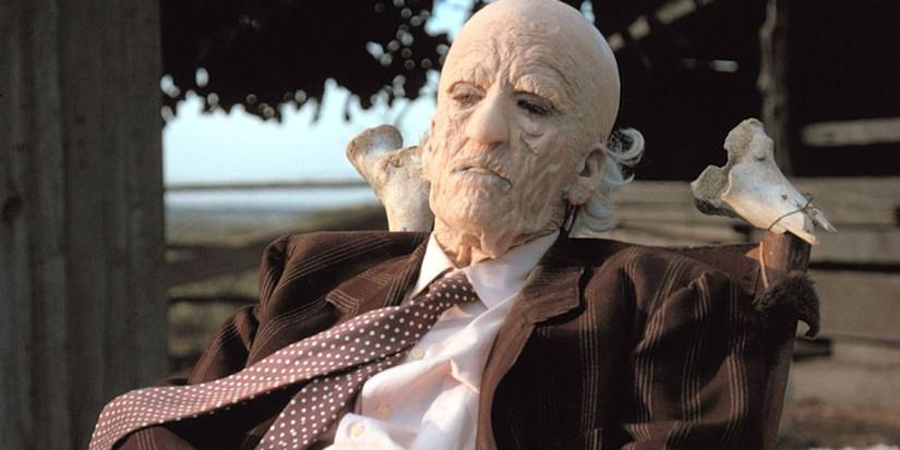 Grandpa from The Texas Chain Saw Massacre sitting outside