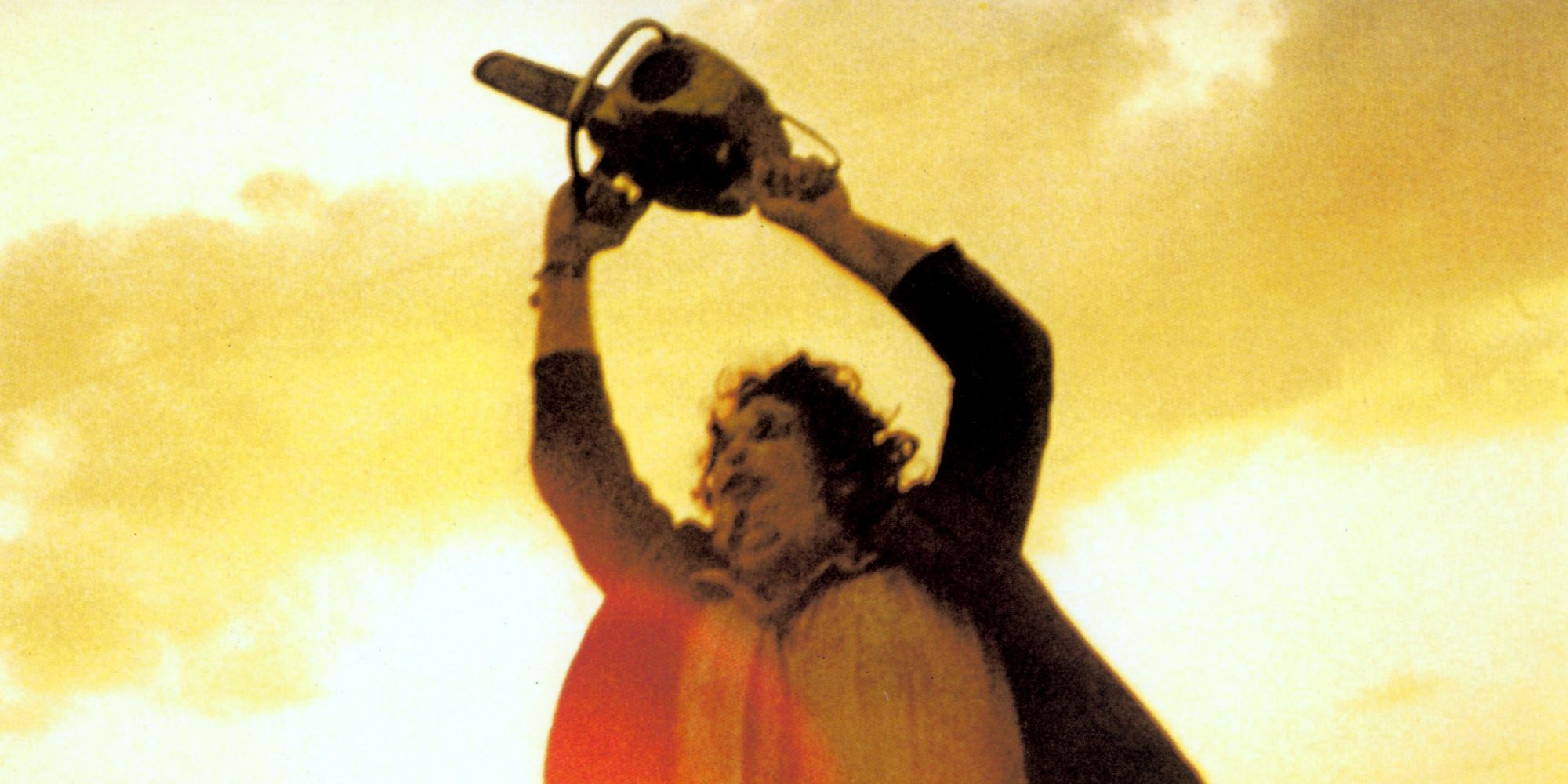 Leatherface raising his chainsaw at the end of The Texas Chain Saw Massacre