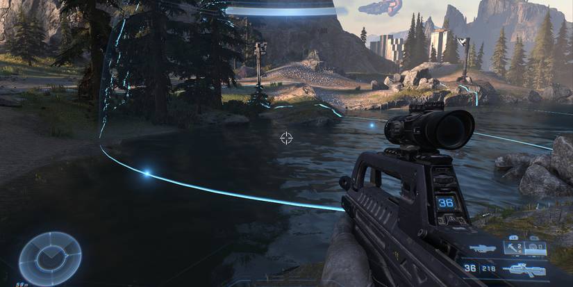 two, blue lights emitting faintly visible blue hemispheres over a small body of water