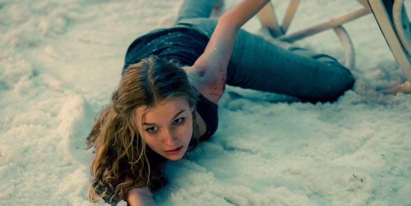 Ashley lying in the snow in Better Watch Out