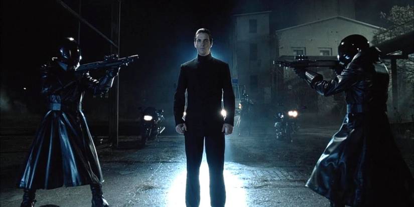 equilibrium protagonist held at gunpoint in dark alley