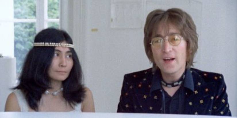 john lennon at a piano with yoko