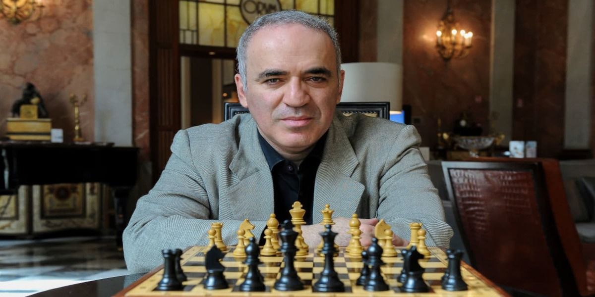 Kasparov looking over chess board