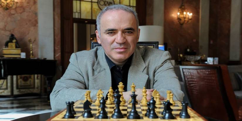Kasparov looking over chess board