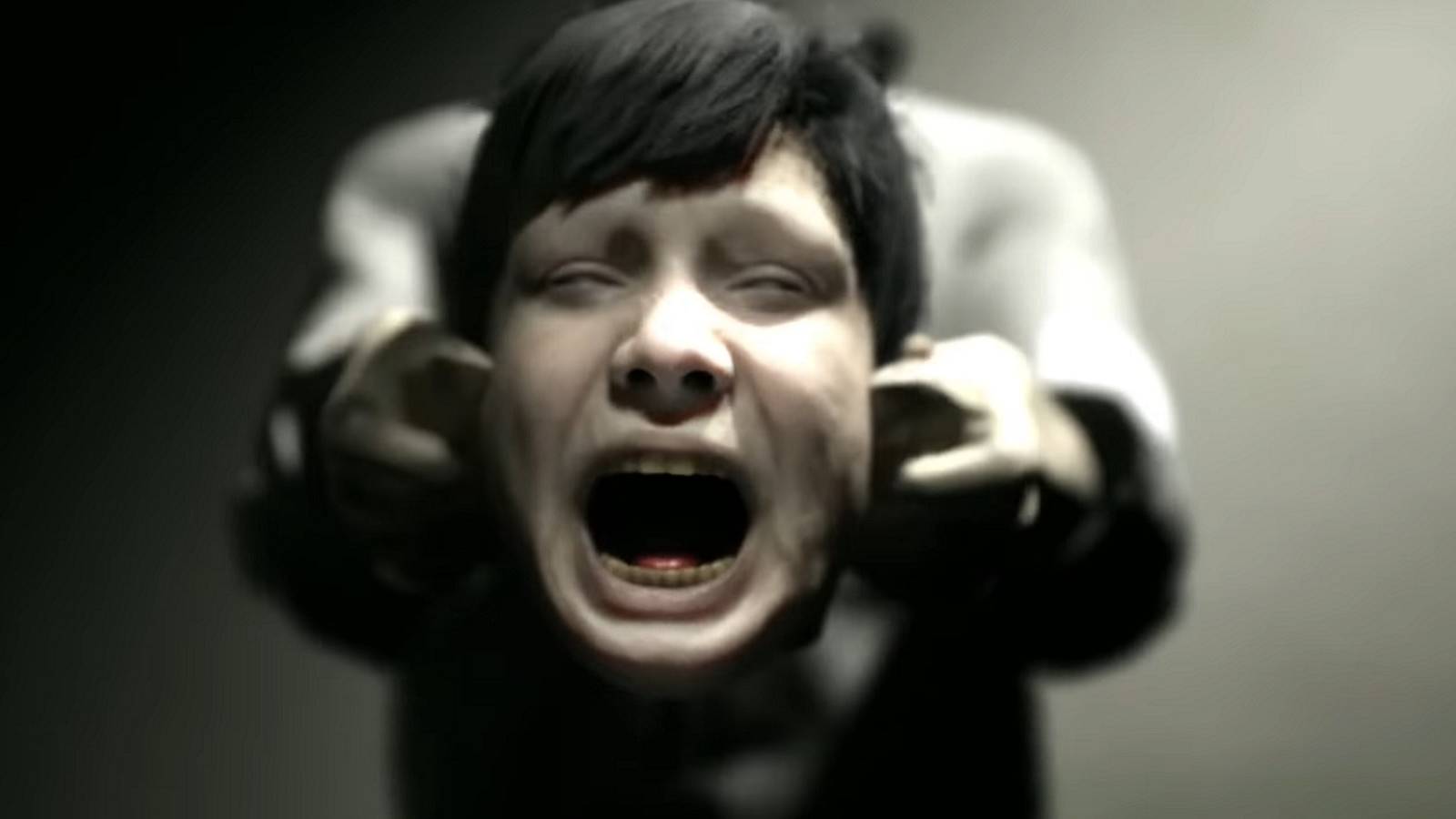 An image from upcoming horror game Stray Souls showing a screaming head being held in someone's hands.