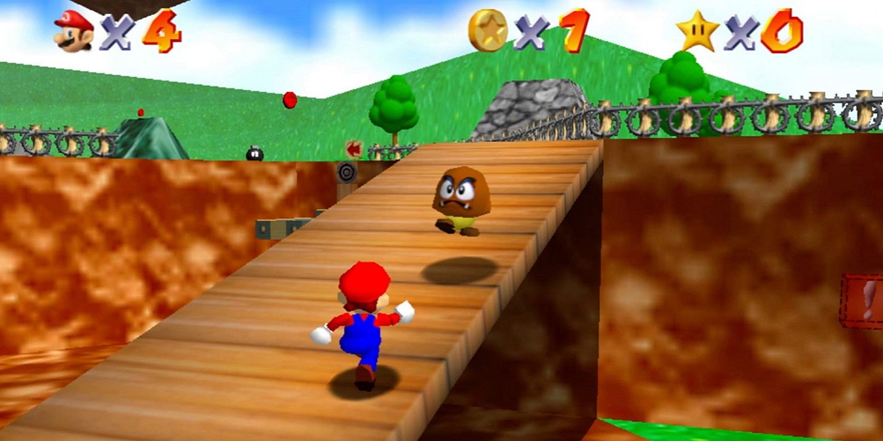 Screenshot from Super Mario 64 showing Mario running towards a Goomba.