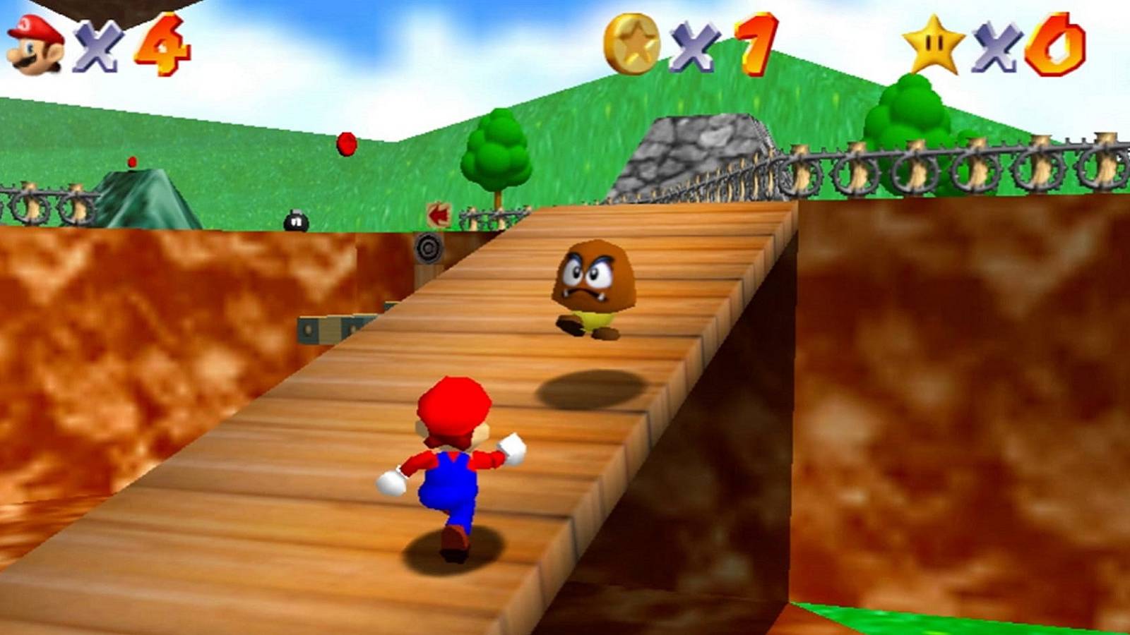 Screenshot from Super Mario 64 showing Mario running towards a Goomba.