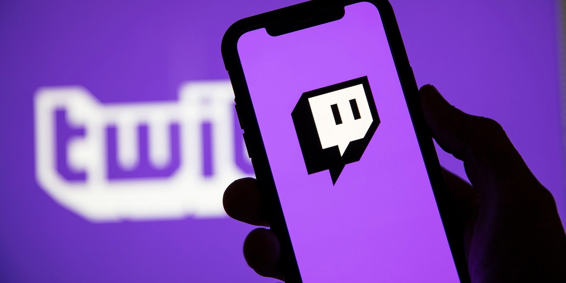 Picture of a phone with the Twitch logo on a bright purple screen.
