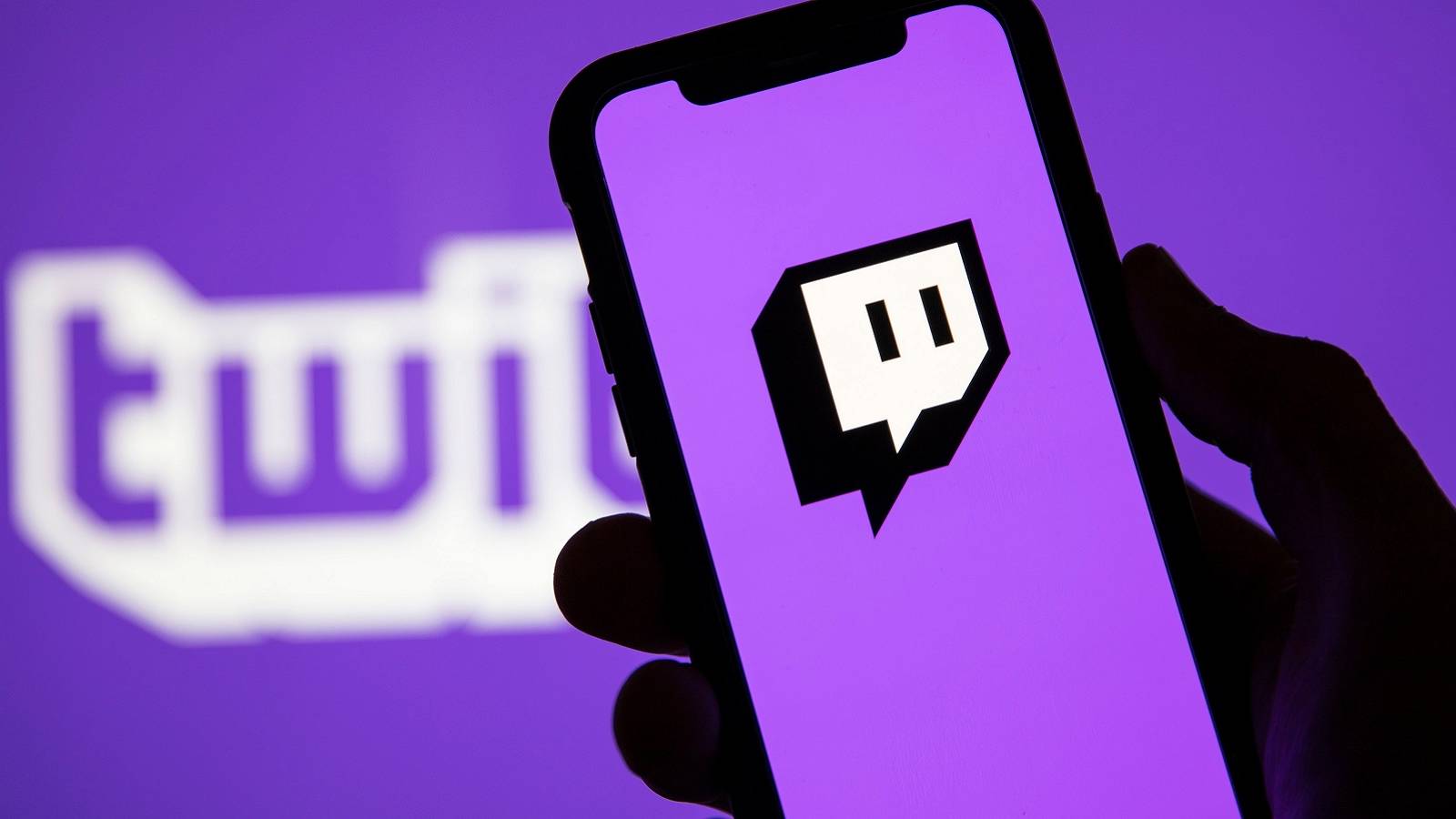 Picture of a phone with the Twitch logo on a bright purple screen.