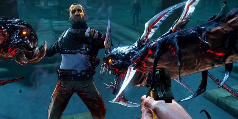 Fighting enemies in The Darkness 2