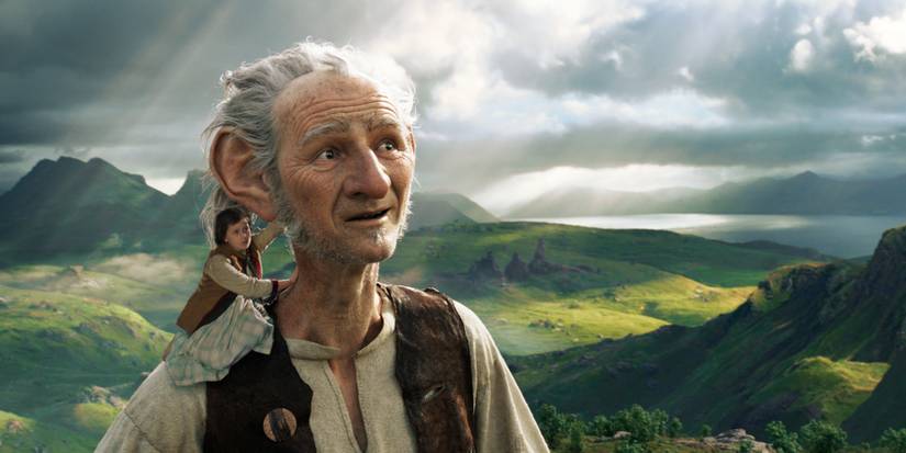 The big friendly giant carries the little girl Sophie through Giant Country