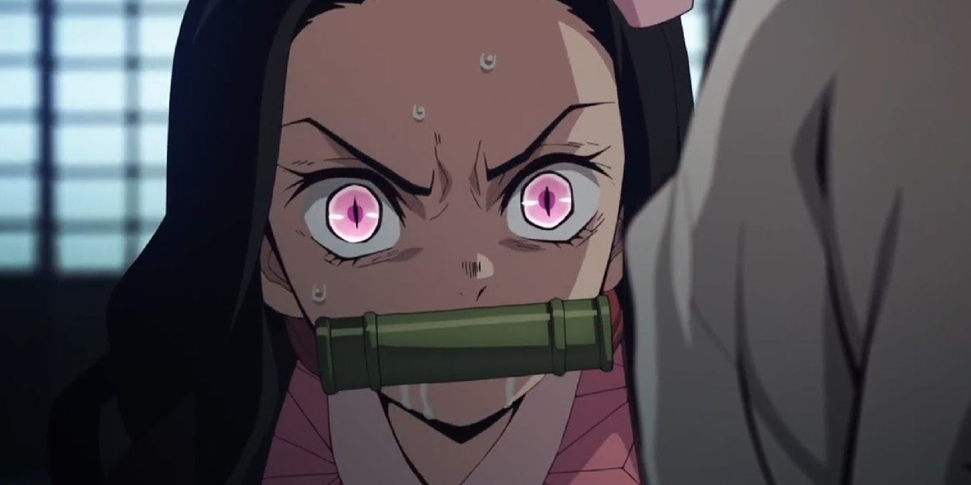 Nezuko looking angry and foaming through her bamboo muzzle