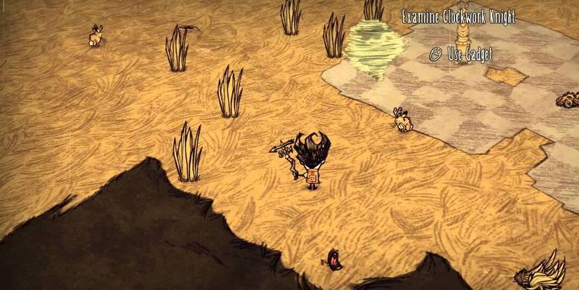 Wilson firing the Weather Pain to remove some grass in Don't Starve Together.