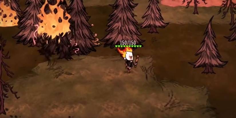 Wilson shooting the Fire Dart at some trees and starting a forest fire in Don't Starve Together.