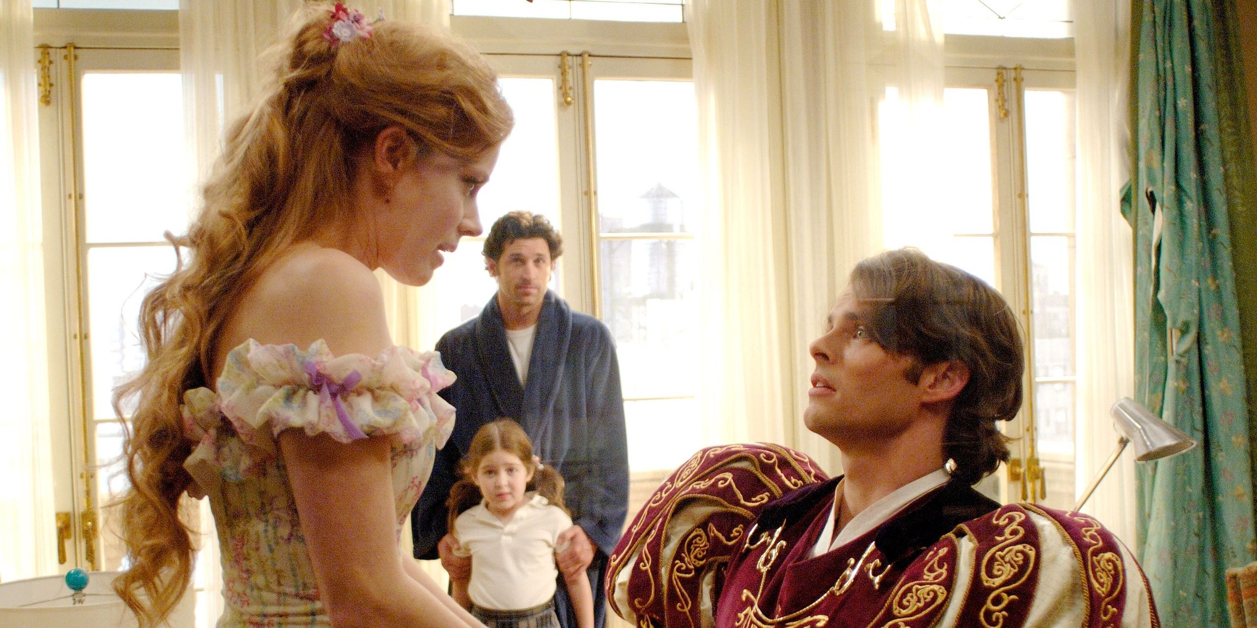 Giselle (Amy Adams) speaks to Prince Edward while Robert (Patrick Dempsey) looks on in confusion