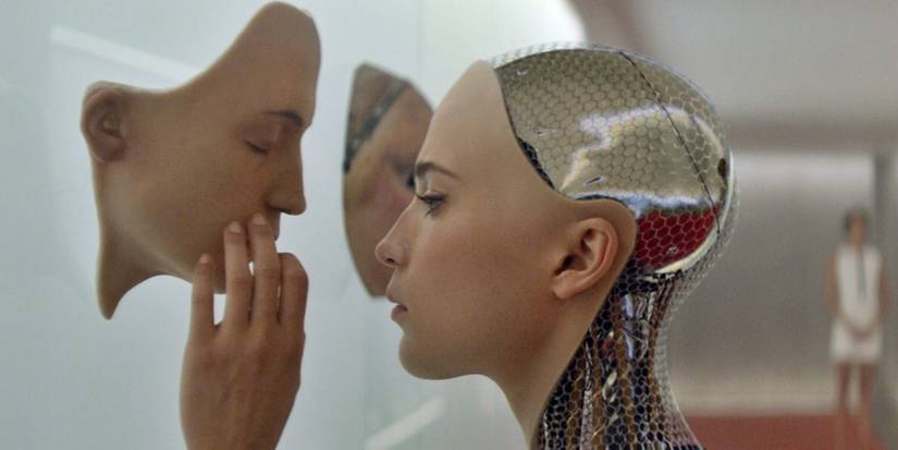 Ex Machina alicia vikander robot examining displayed face on wall