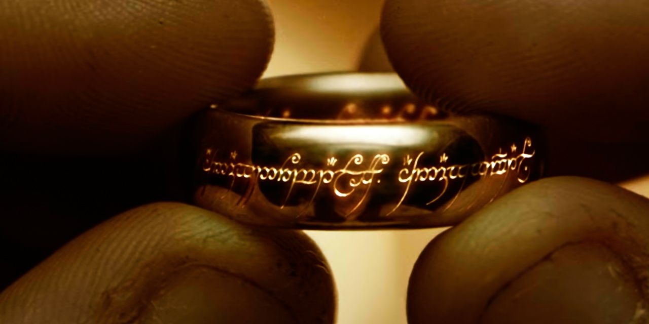 Frodo holding the One Ring as Black Speech appears in Lord of the Rings