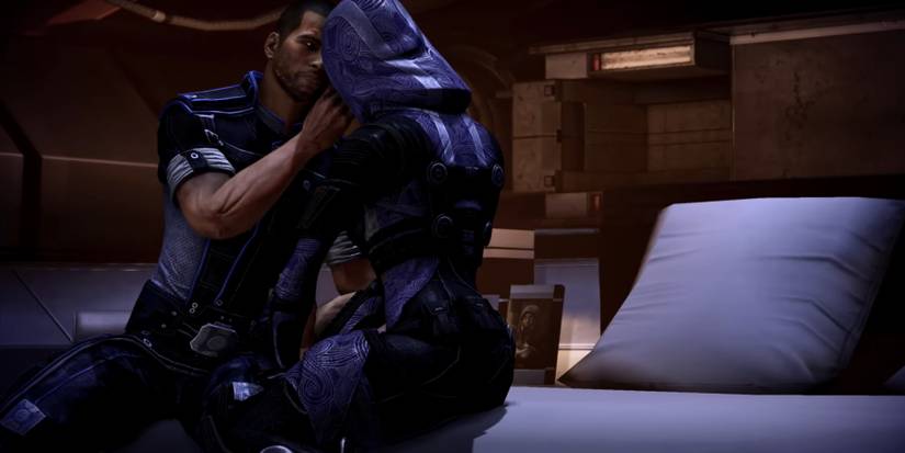 Renegade male Shepard with Tali on Shepard's bed in Mass Effect 3