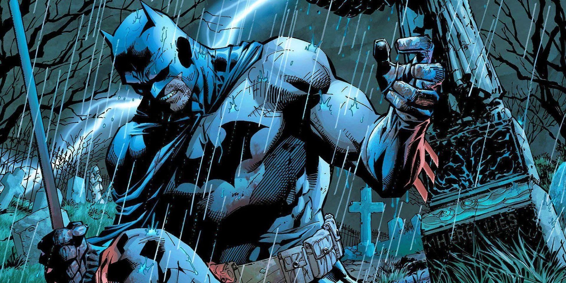 Jim Lee's Batman kneels down in a rainy graveyard in DC comics