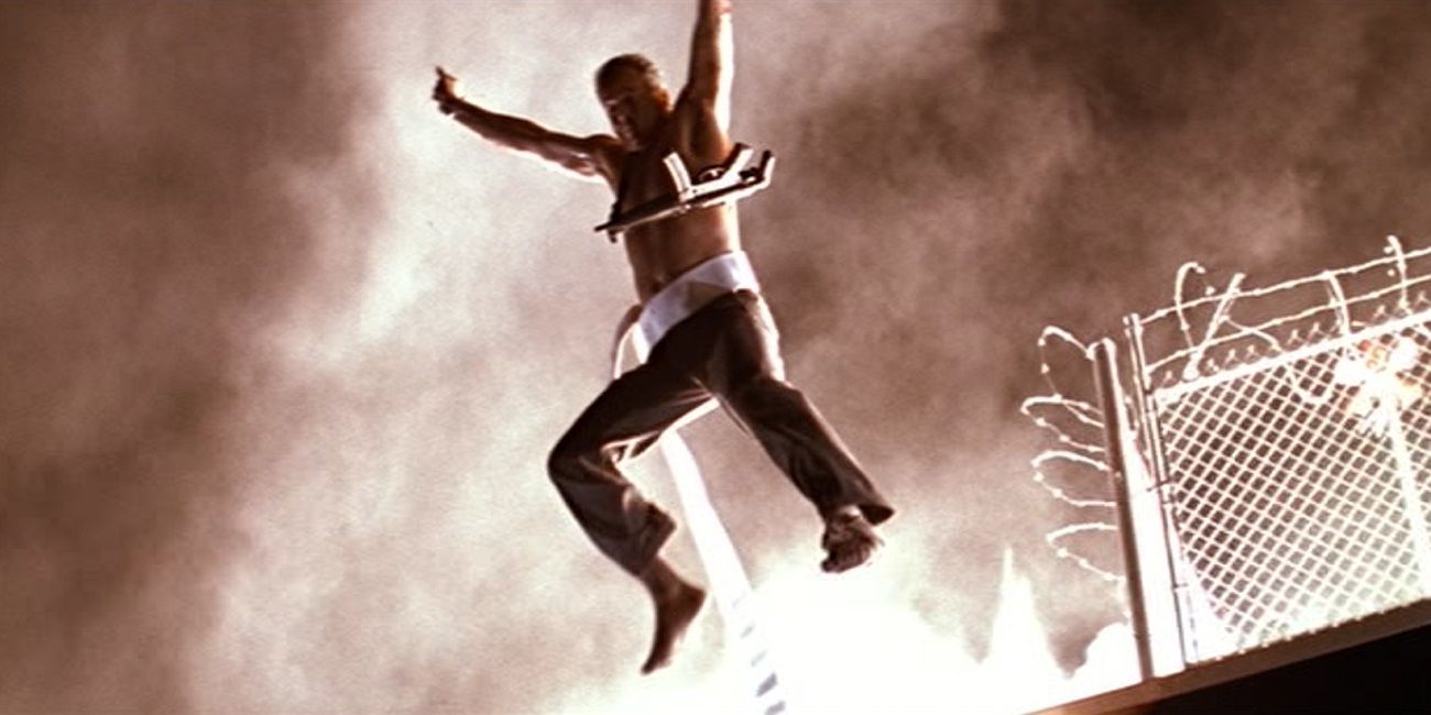 John McClane jumps away from an explosion in Die Hard