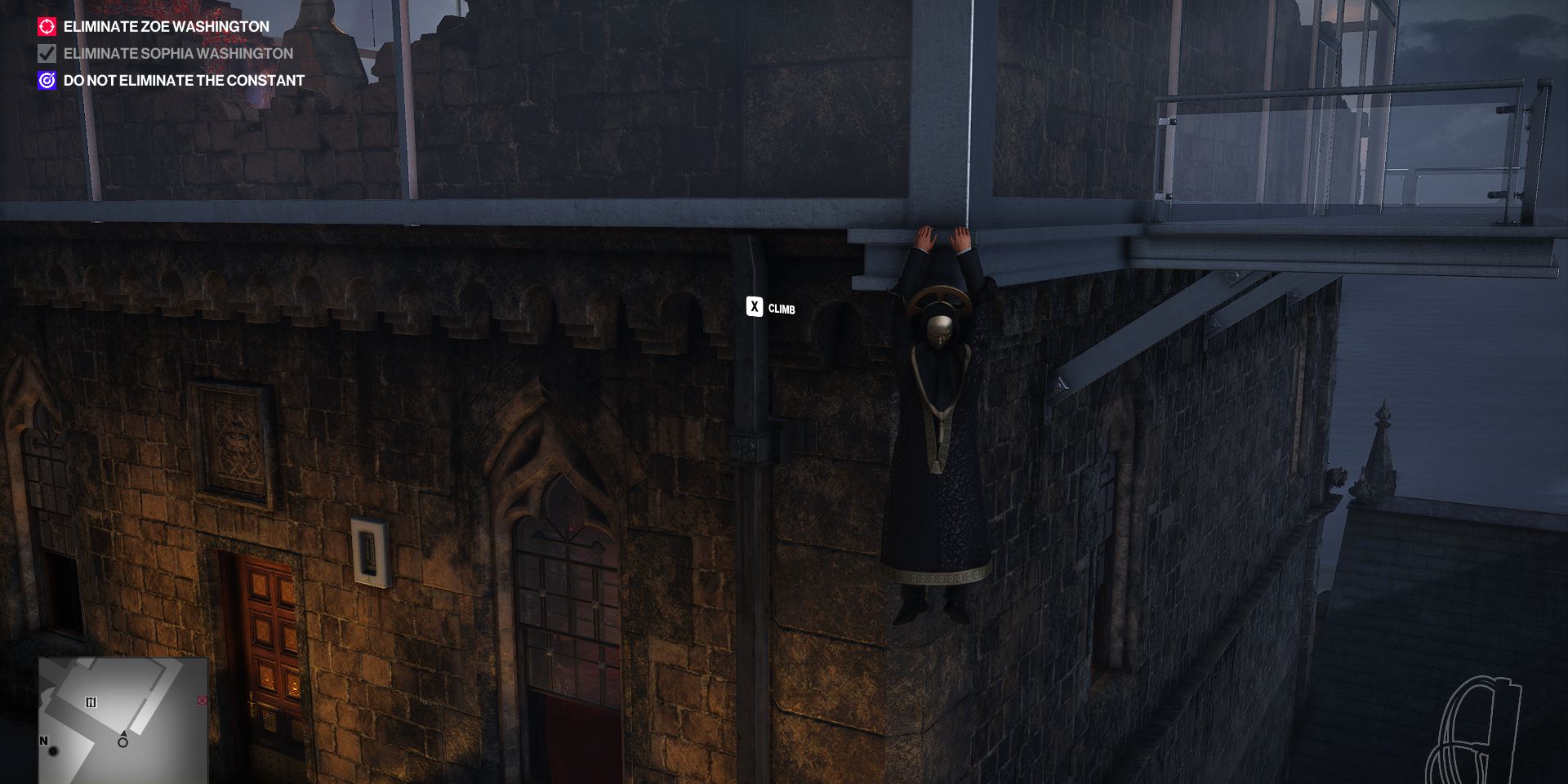 Hitman 2's Agent 47 hangs from a ledge outside an old castle on Isle of Sgail