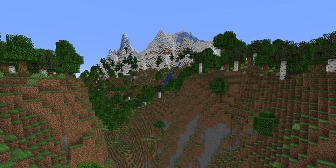 Minecraft Caves and Cliffs scenery with greenery and snowcapped mountains