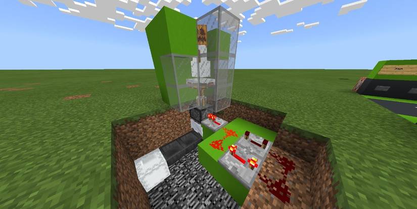 Minecraft snow farm in grassy field with Redstone holding snow golem