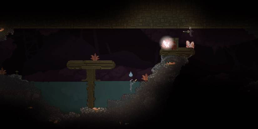 Noita - The spell "Unstable Crystal" is about to go off and explode, as the player has jumped and is about to touch the crystal.
