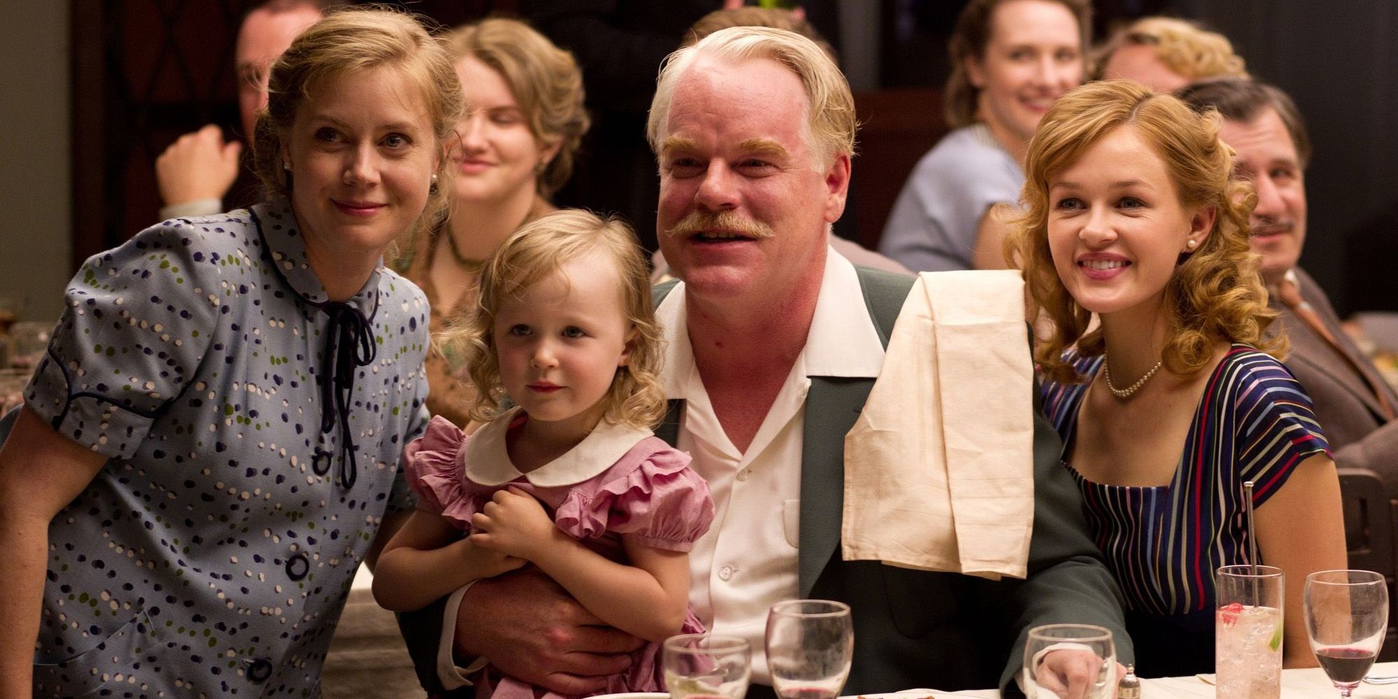 Philip Seymour Hoffman and Amy Adams with the rest of the Dodd family in The Master