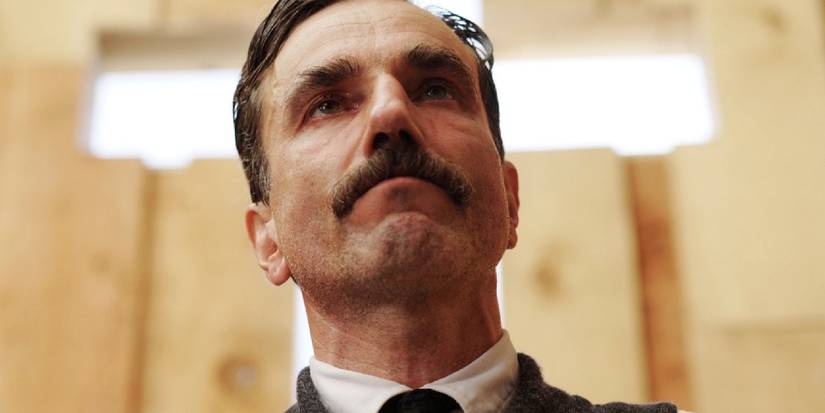 Daniel Day-Lewis kneeling at church in There Will Be Blood