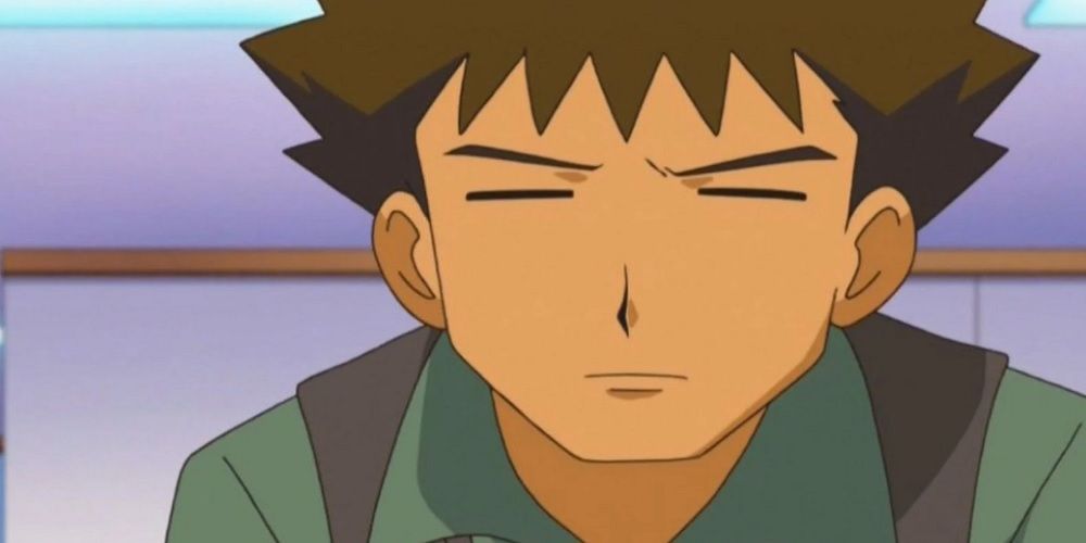 Pokemon anime Brock looking closely at something off-screen