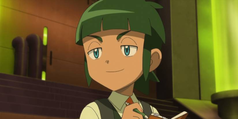 Pokemon anime Sawyer smiling while writing in notepad
