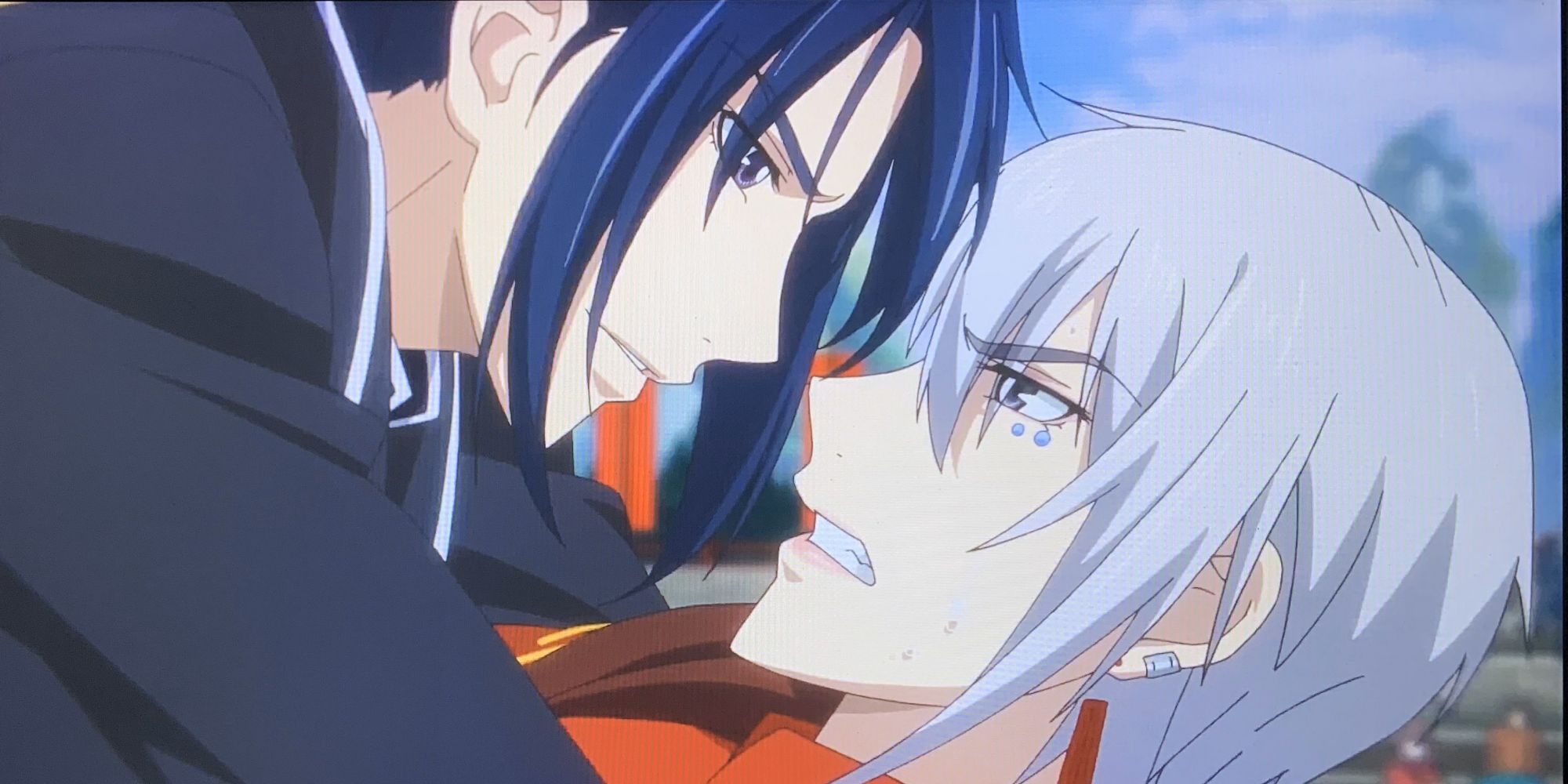 Two main characters from Spiritpact holding one another