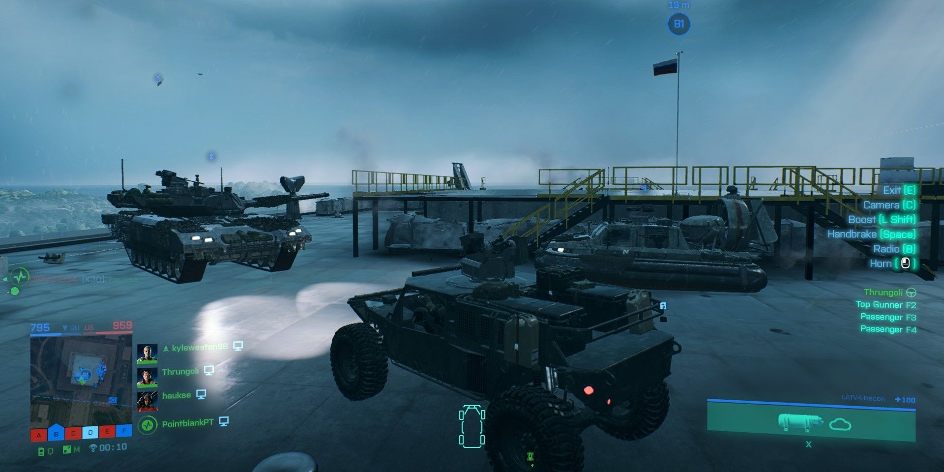 A tank, an LATV4 Recon, and an LCAA Hovercraft camping a rooftop objective in Battlefield 2042