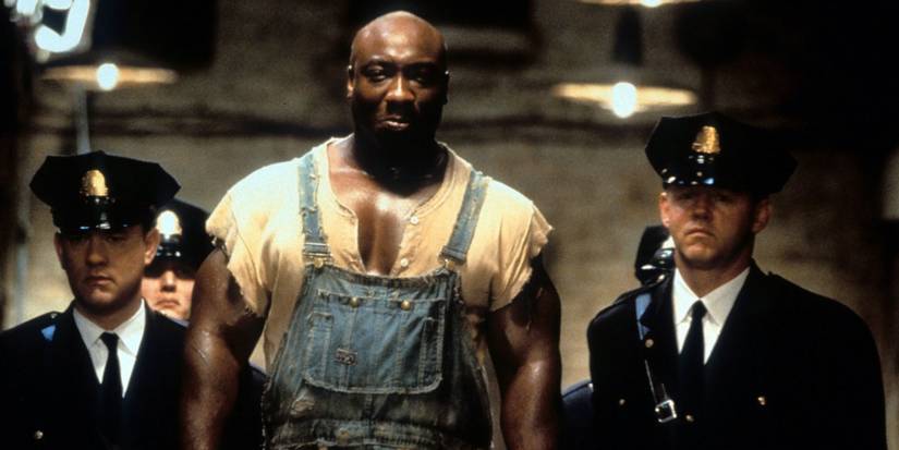Prisoner escorted by guards on death row in The Green Mile