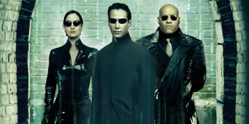 The Matrix's Trinity, Neo, and Morpheus pose in front of a wall with green numbers in the background