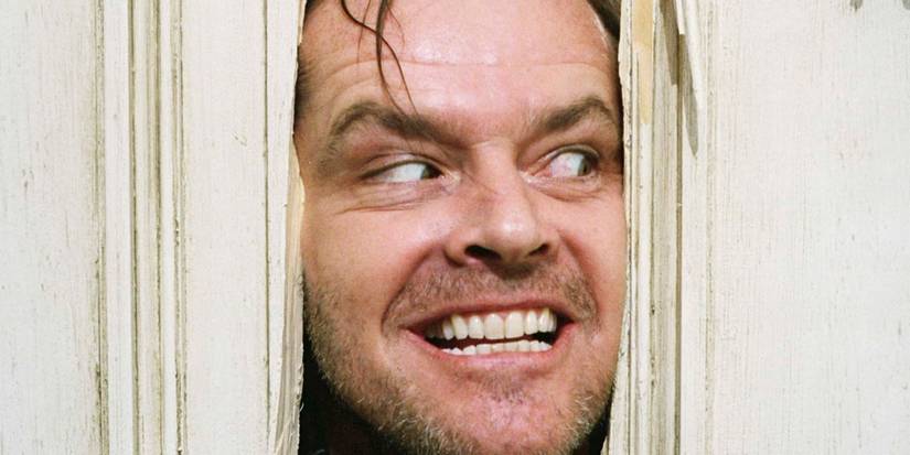 Jack Nicholson pressing his face to the door in The Shining