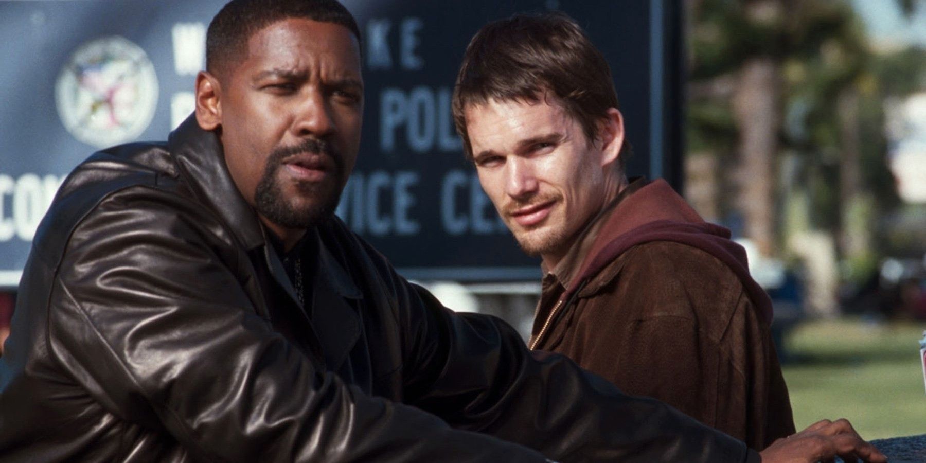 LAPD officers Alonzo Harris (Denzel Washington) and Jake Hoyt (Ethan Hawke) look into the camera in the movie Training Day.
