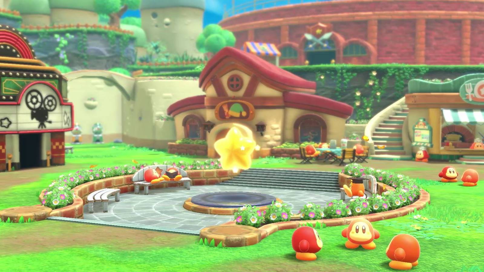 Kirby and the Forgotten Land's Waddle Dee Town, with a movie theater, restaurant, battle arena, Warp Star, and many Waddle Dees visible