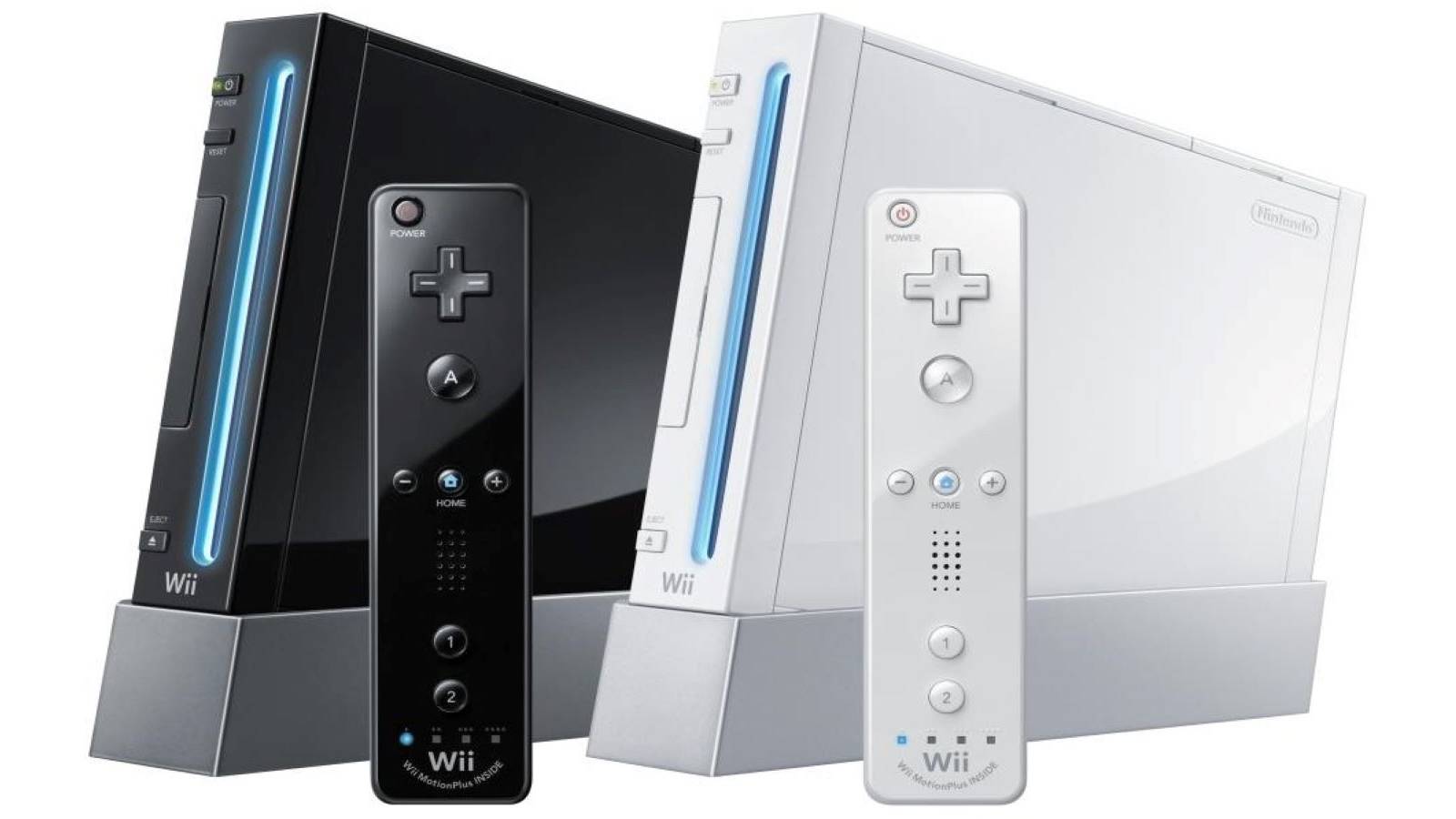 A white Wii and a black Wii side by side with two Wiimotes in front