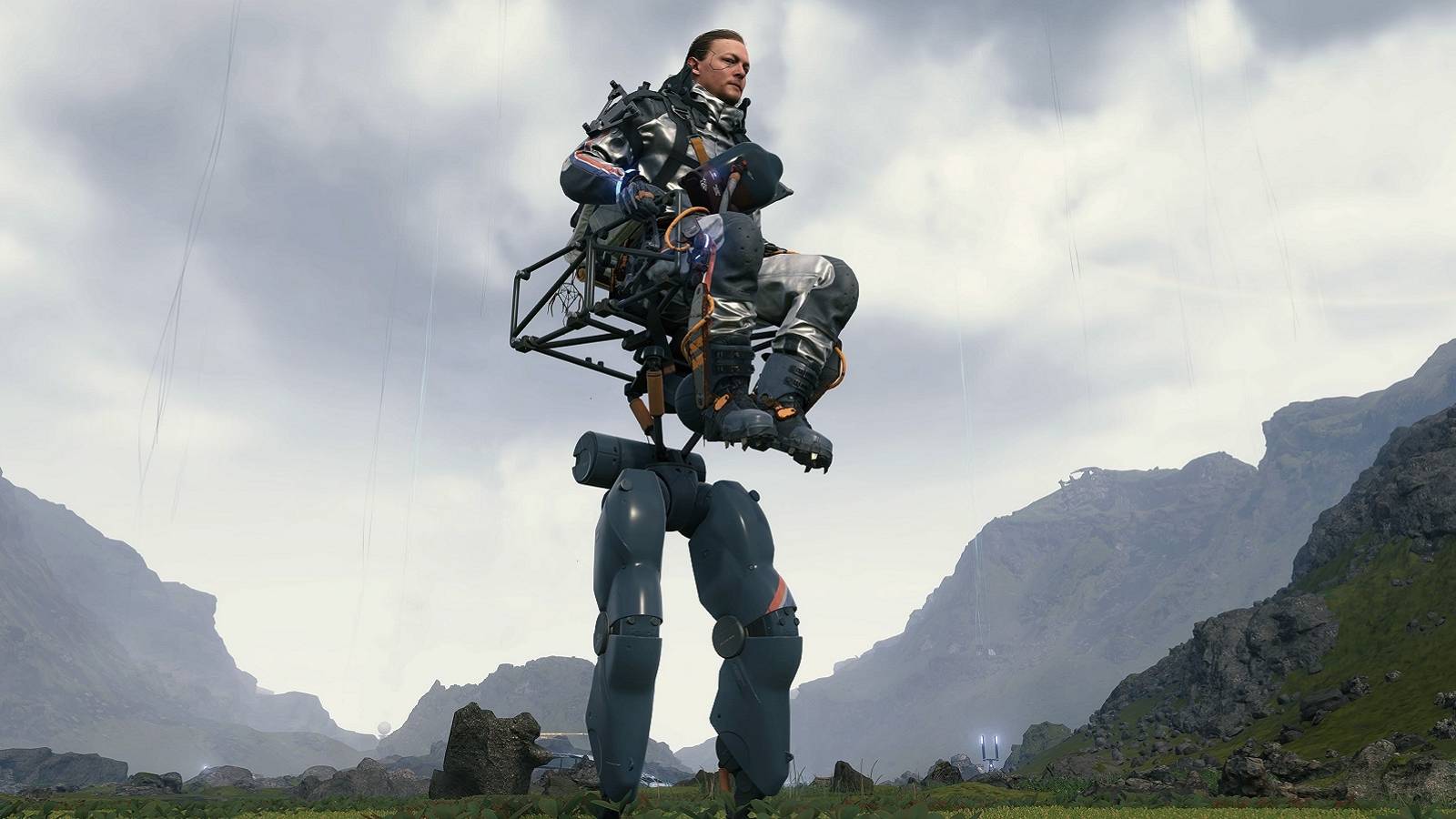 Screenshot from Death Stranding showing protagonist Sam on a power skeleton outside.