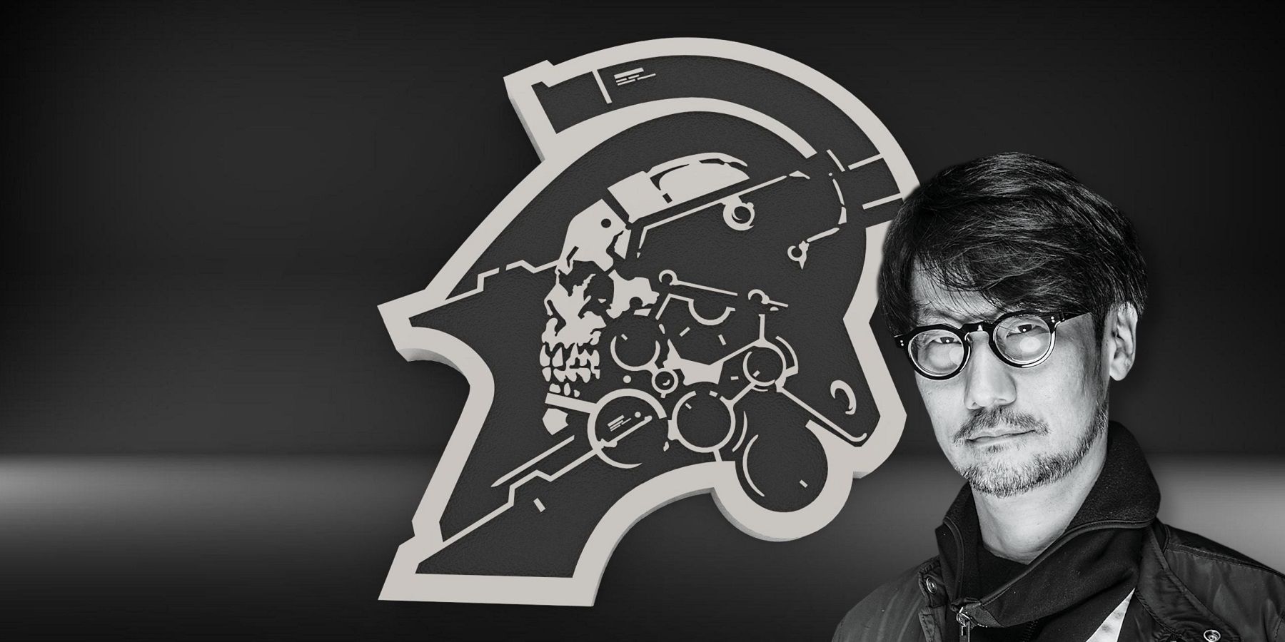 Black and white photo of Hideo Kojima in front of the Kojima Productions logo.